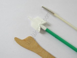 This picture shows examples of the wooden cervical spatula, and two different types of cervical brush used to take cervical cell samples from women, screening to see the health of the cells on their cervix and just in to the entrance of their cervix - external cervical os, and transformation zone - whilst having a PAP test / cervical smear test / Papanicolaou test